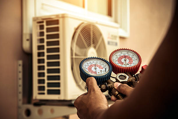Professional Air Conditioning Service technician working in Pearson, GA